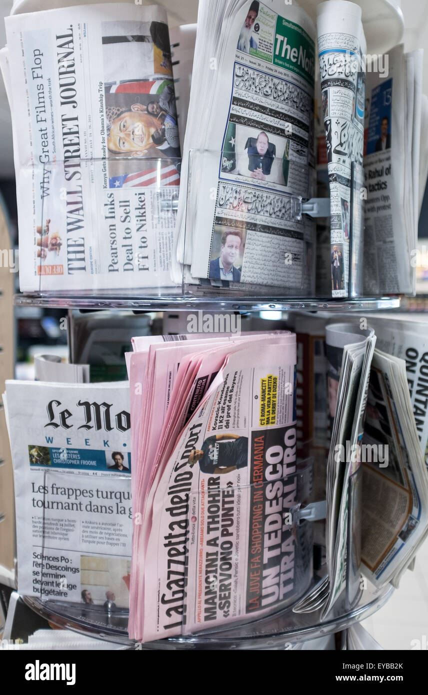 A selection of foreign newspapers on sale Stock Photo