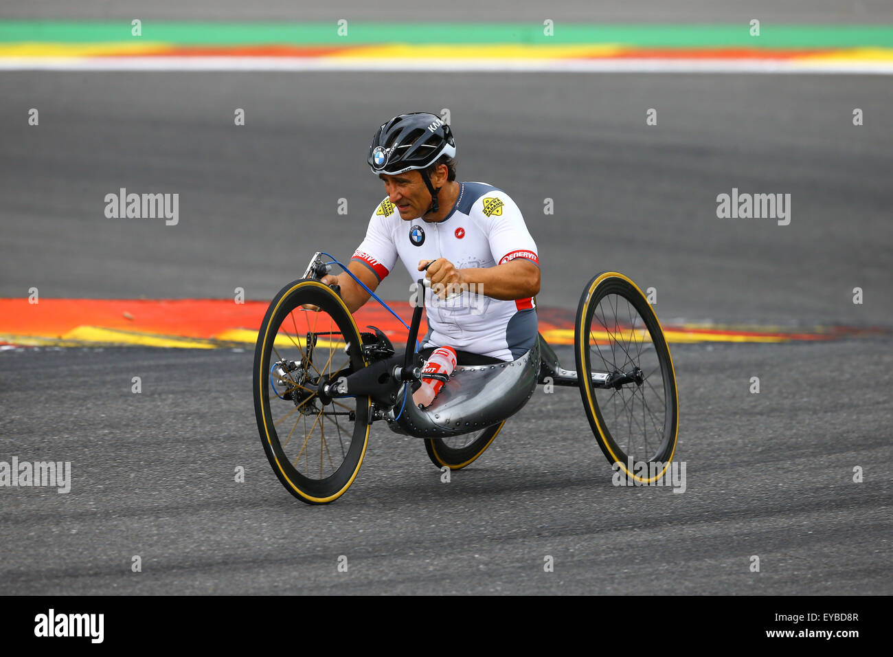 Spa Francorchamps, France. 24th July, 2015. A specially adapted hand-driven bike is demonstrated by Alex Zanardi, who raced against Timo Glock on a regular racing bike. © Action Plus Sports/Alamy Live News Stock Photo