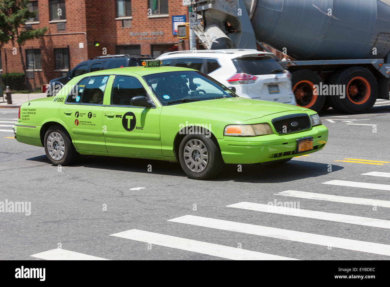 A green Boro Taxi in Washington Heights in New York City. Stock Photo
