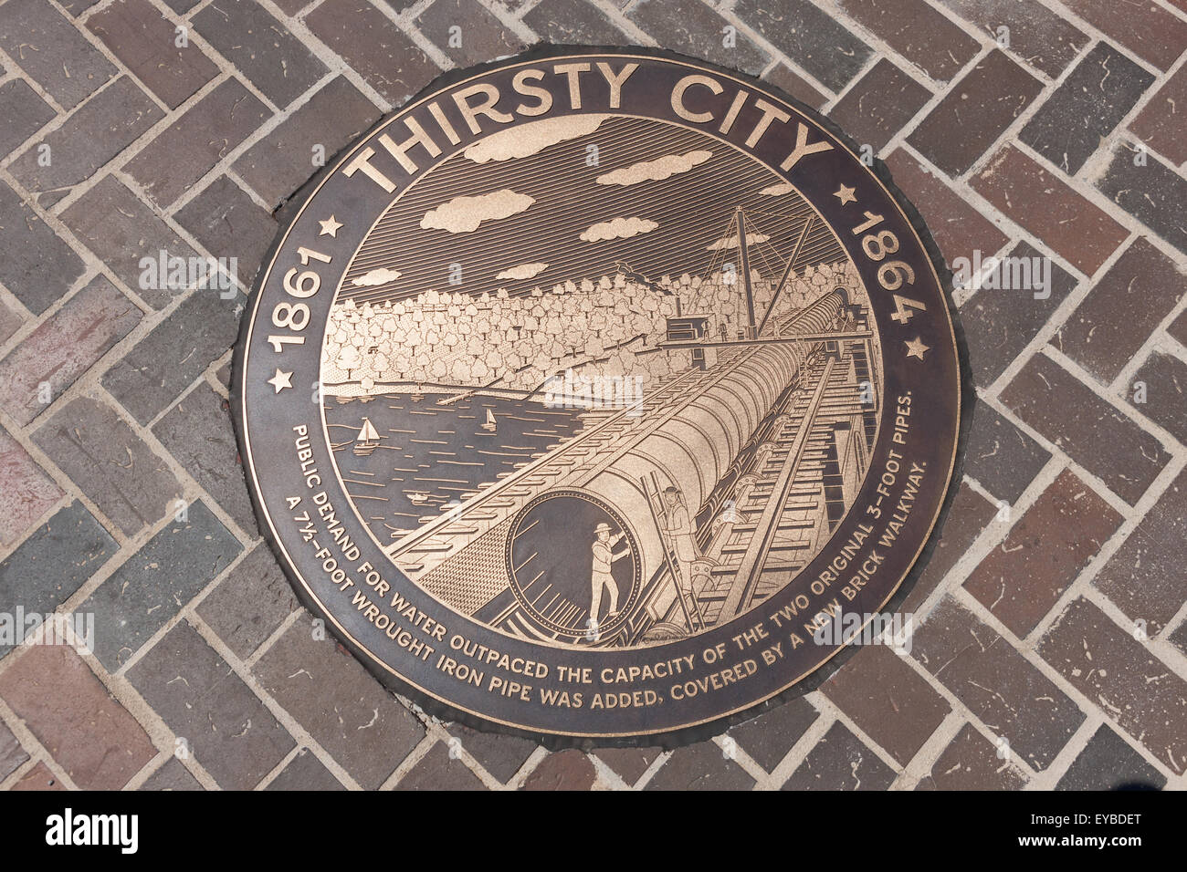 Bronze medallion in the walkway of the High Bridge connecting Manhattan with the Bronx over the Harlem River in New York City. Stock Photo