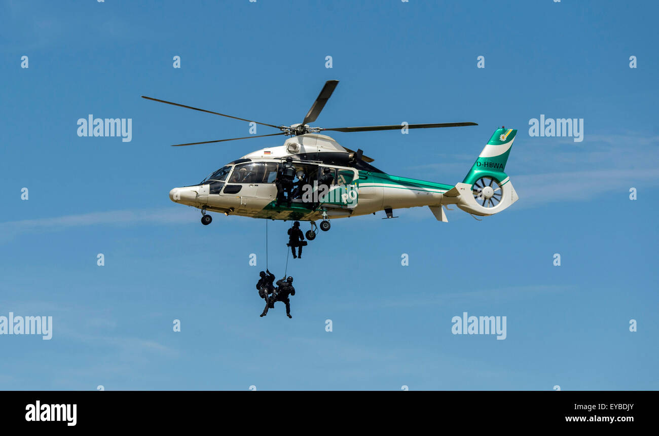 Stuttgart, Germany. 26th July, 2015. Special forces perform a rescue effort with a Eurocopter EC 155 in the context of the event '50 years of Police Helicopter Squadron Baden-Wuerttemberg' in Stuttgart, Germany, 26 July 2015. Photo: DANIEL MAURER/dpa/Alamy Live News Stock Photo