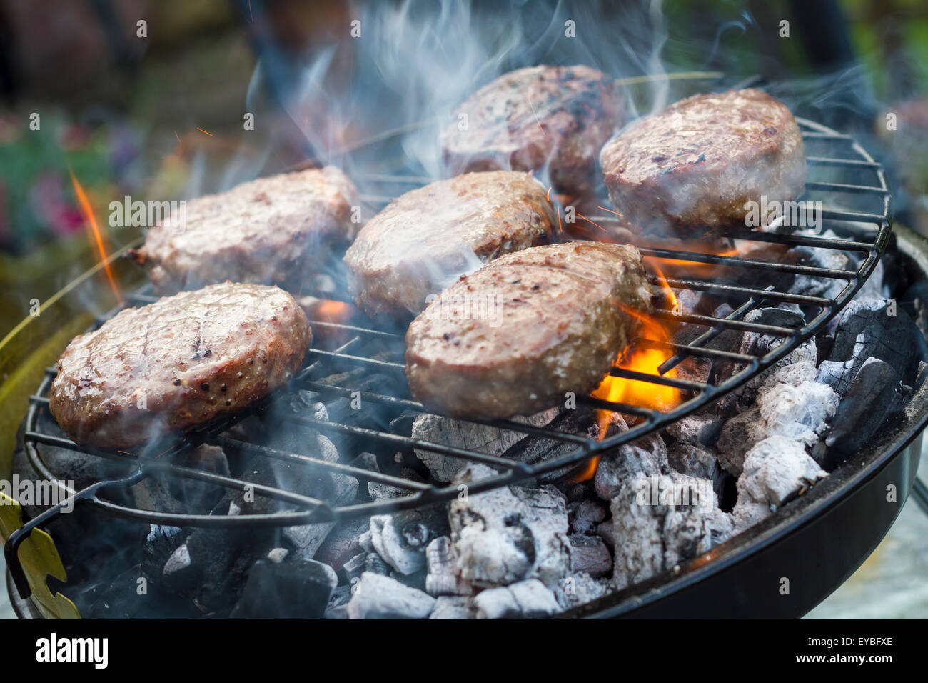 Meat cooking on a BBQ barbecue grill Stock Photo