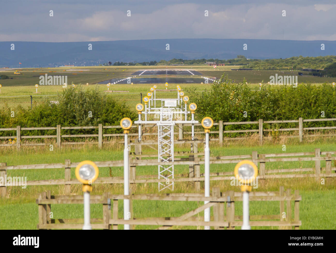 Looking down the runway at Manchester Airport. Top of image shows heat haze. Stock Photo