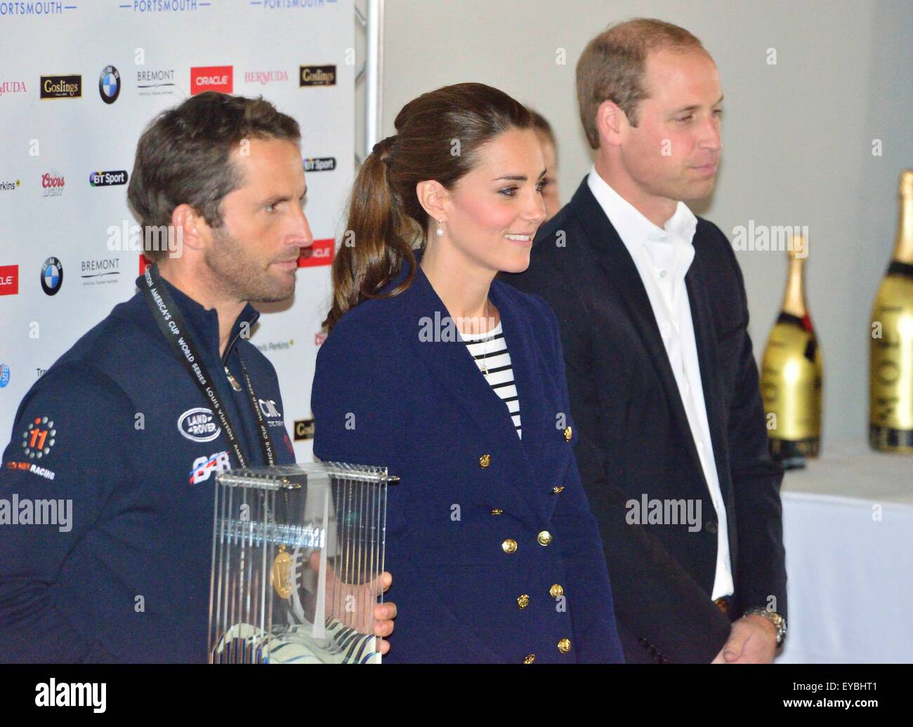 Portsmouth, Hampshire, UK. 26th July, 2015. The Duke and Duchess of Cambridge present Sir Ben Ainslie, skipper of the British 'Land Rover BAR' team with the cup for winning the Louis Vuitton America's Cup World Series Portsmouth at the official prize giving.  The cup was designed by 5 year old Leo Howard from a local school on behalf of the 1851 Trust and made by artist Michelle Littlewood.Self billing. Credit:  Wendy Johnson/Alamy Live News (photographer media accredited for this event) Stock Photo