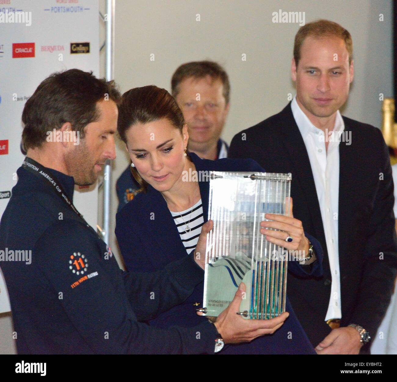 Portsmouth, Hampshire, UK. 26th July, 2015. The Duke and Duchess of Cambridge present Sir Ben Ainslie, skipper of the British 'Land Rover BAR' team with the cup for winning the  Louis Vuitton America's Cup World Cup Series Portsmouth at the official prize giving.  The cup was designed by 5 year old Leo Howard from a local school on behalf of the 1851 Trust and made by artist Michelle Littlewood. Credit:  Wendy Johnson/Alamy Live News (photographer media accredited for this event) Stock Photo