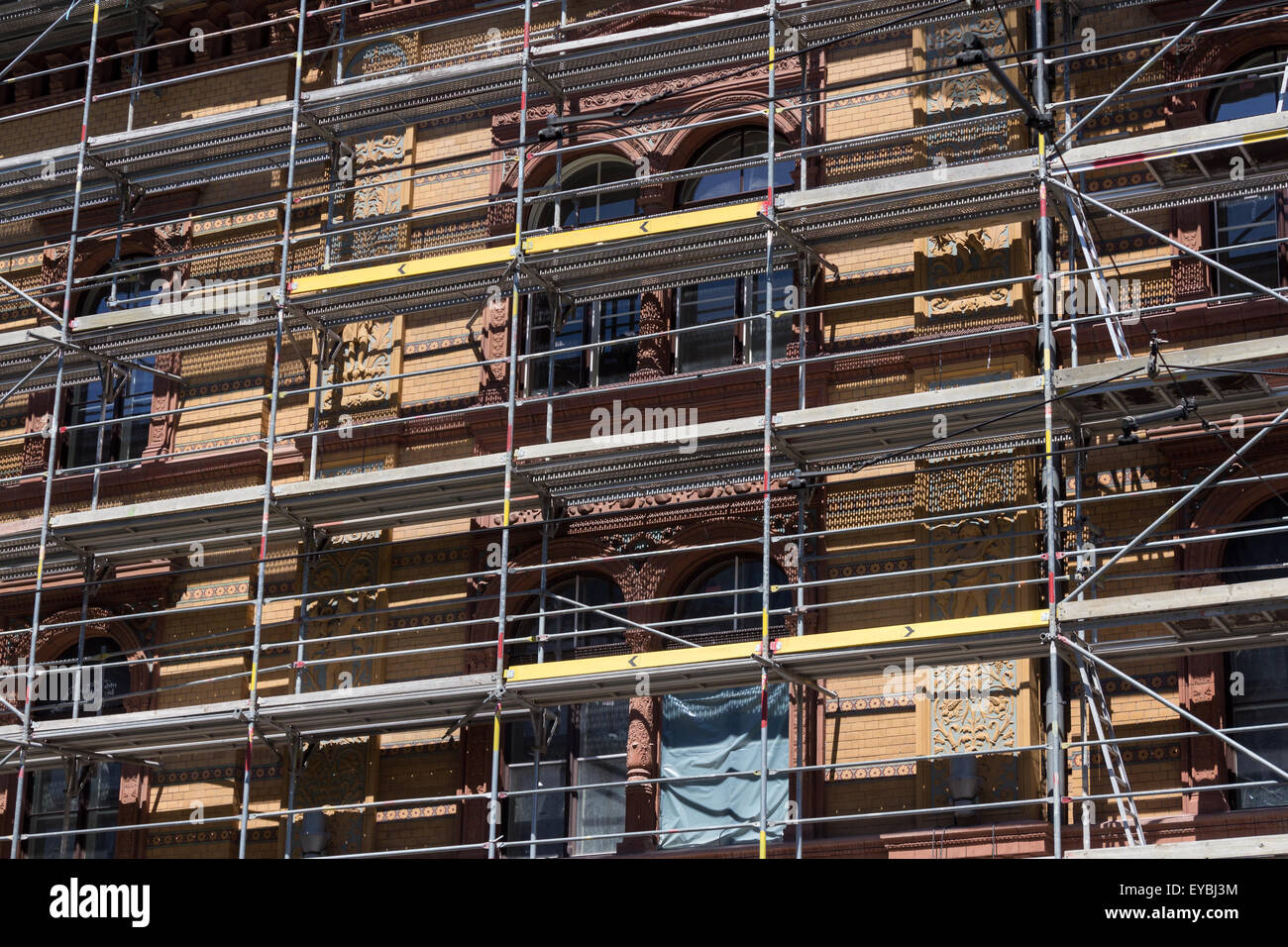 scaffolding on building facade - construction site Stock Photo