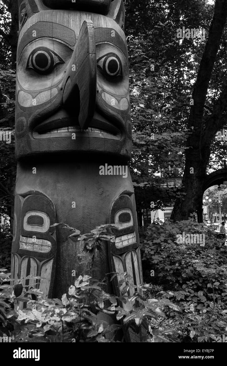 Downtown Seattle at Pioneer Square with totems, Native American Art form in black and white Stock Photo