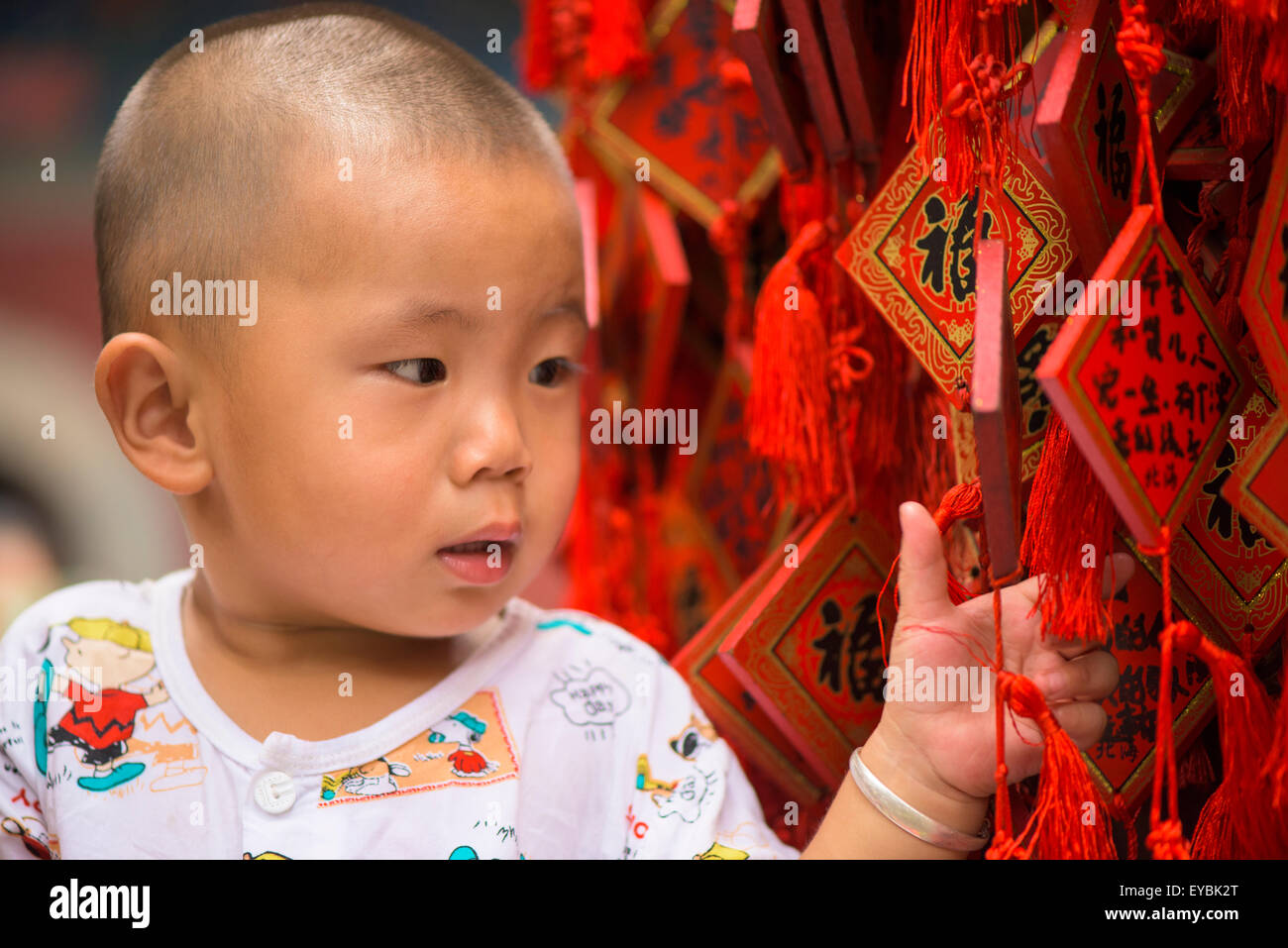 Chinese baby in buddhist temple on Jade Island, Bei Hai Park, Beijing, China, July 2015 Stock Photo