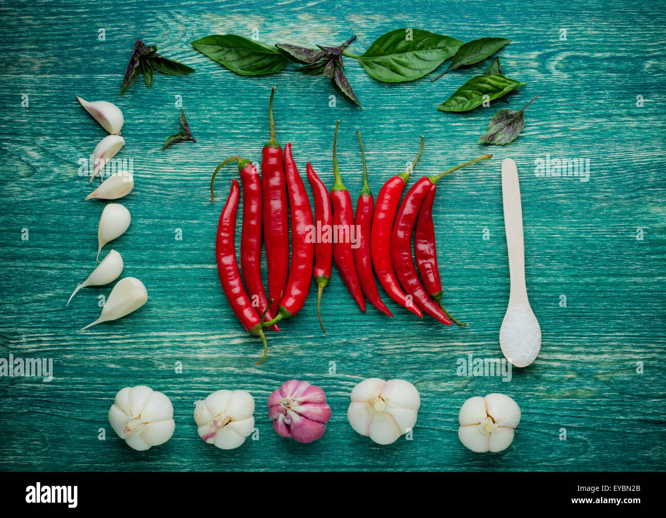 Red hot chili peppers on wooden background Stock Photo - Alamy