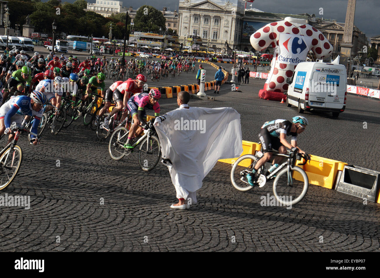 Paris, France. 26th July, 2015. Protester runs in front of the Tour de France peleton on the final lap of the last stage in Paris, France on 26th July 2015. Credit: Maurice Savage/Alamy Live News Stock Photo