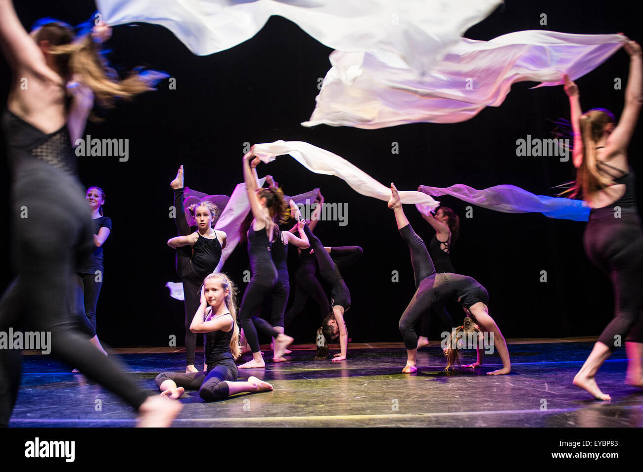 A group of teenage girls performing choreographed dance routines on stage at Aberystwyth Arets Centre Wales UK Stock Photo