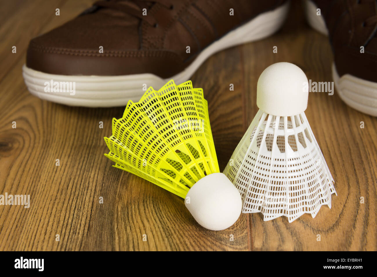 shuttlecocks for badminton white and yellow on the wooden floor Stock Photo