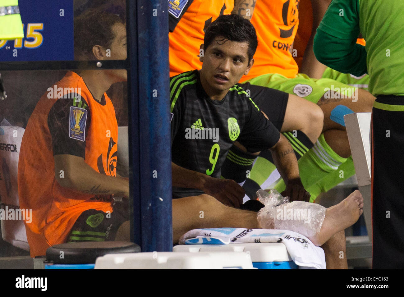 Philadelphia, Pennsylvania, USA. 26th July, 2015. Mexico forward Jesus Corona (9) talks with midfielder Andres Guardado (18), who has his left leg iced up, on the sidelines during the CONCACAF Gold Cup 2015 Final match between Jamaica and Mexico at Lincoln Financial Field in Philadelphia, Pennsylvania. Mexico won 3-1. Christopher Szagola/CSM Stock Photo
