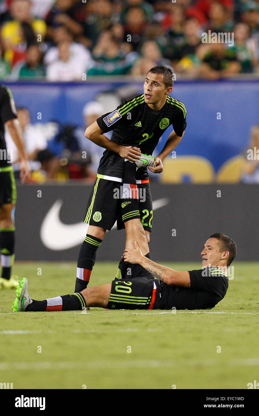 Philadelphia, Pennsylvania, USA. 26th July, 2015. Mexico defender Paul Aguilar (22) stretches out midfielder Jesus Duenas (20) during the CONCACAF Gold Cup 2015 Final match between Jamaica and Mexico at Lincoln Financial Field in Philadelphia, Pennsylvania. Mexico won 3-1. Christopher Szagola/CSM Stock Photo