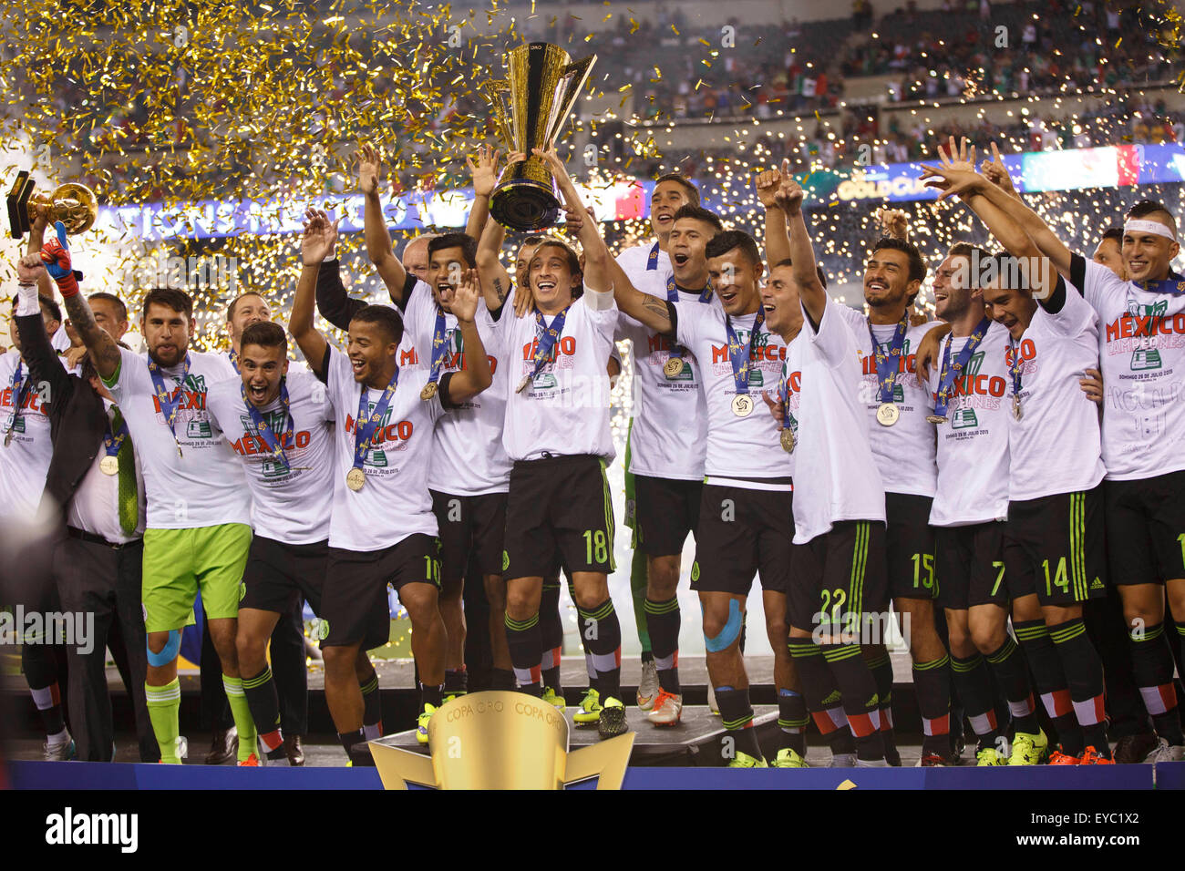 Philadelphia, Pennsylvania, USA. 26th July, 2015. Mexico midfielder Andres Guardado (18) holds the CONCACAF Gold Cup Trophy while surrounded by teammates following the CONCACAF Gold Cup 2015 Final match between Jamaica and Mexico at Lincoln Financial Field in Philadelphia, Pennsylvania. Mexico won 3-1. Christopher Szagola/CSM Stock Photo