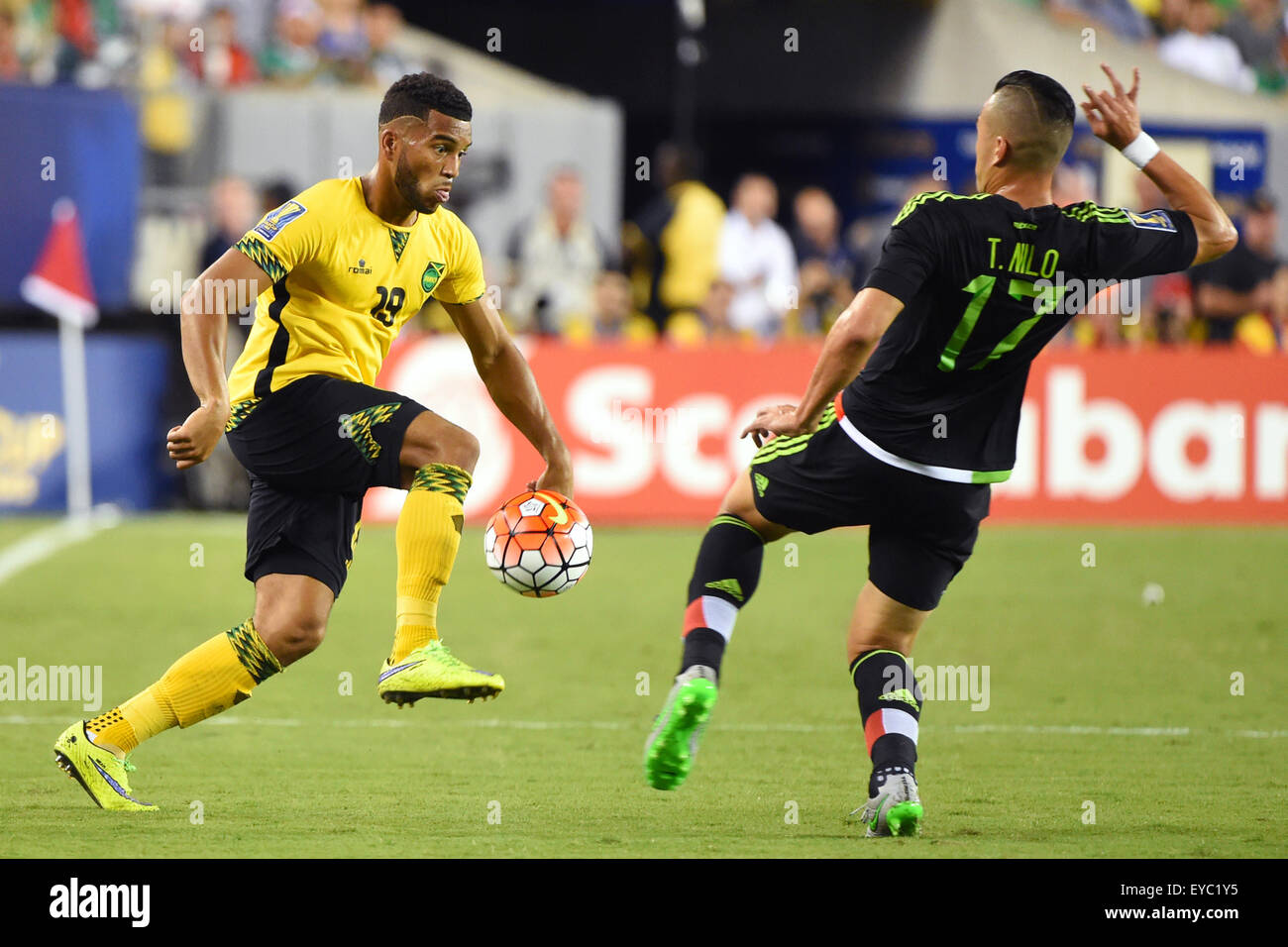 Philadelphia, Pennsylvania, USA. 26th July, 2015. Jamaica defender Adrian Mariappa #19 controls the ball around the defense of Mexico midfielder Jorge Torres Nilo #17 during the 2015 CONCACAF Gold Cup final between Jamaica and Mexico at Lincoln Financial Field in Philadelphia, Pennsylvania. Mexico defeated Jamaica 3-1. Rich Barnes/CSM/Alamy Live News Stock Photo
