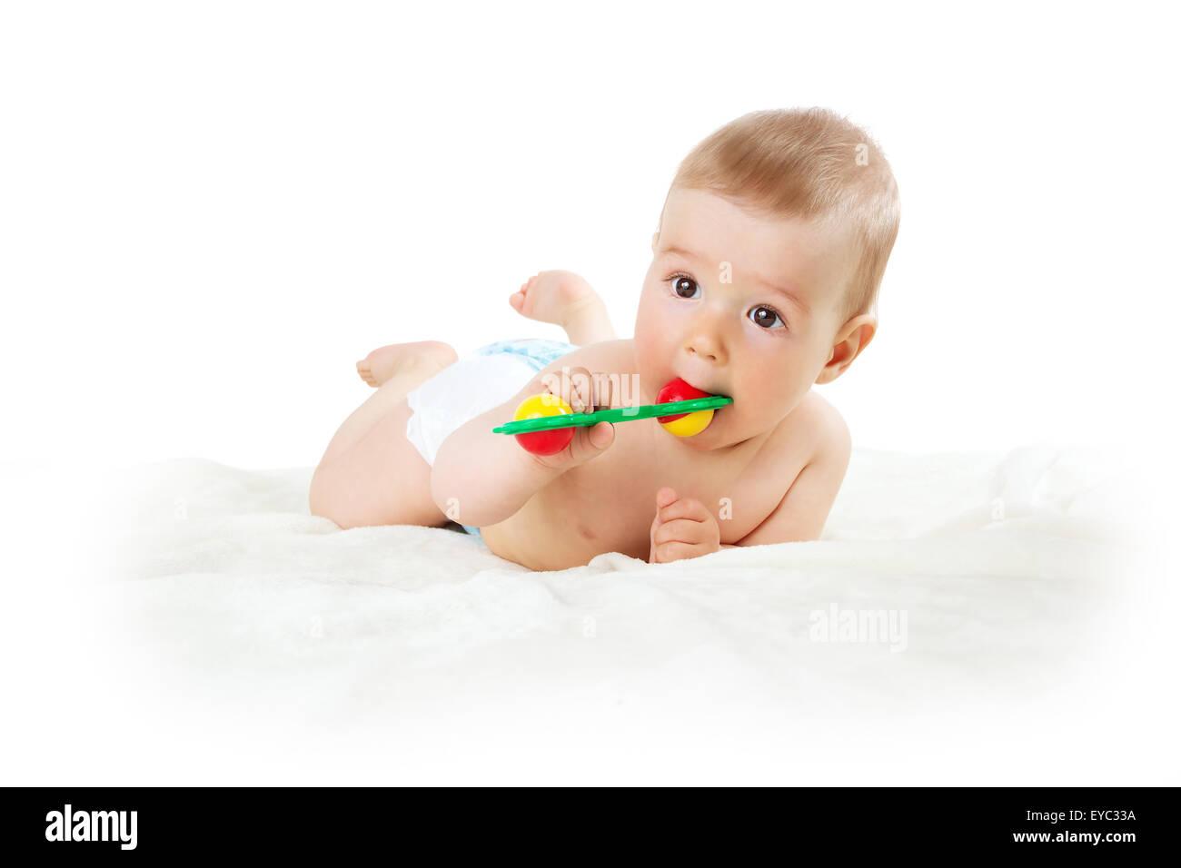 Baby holding a toy Stock Photo Alamy