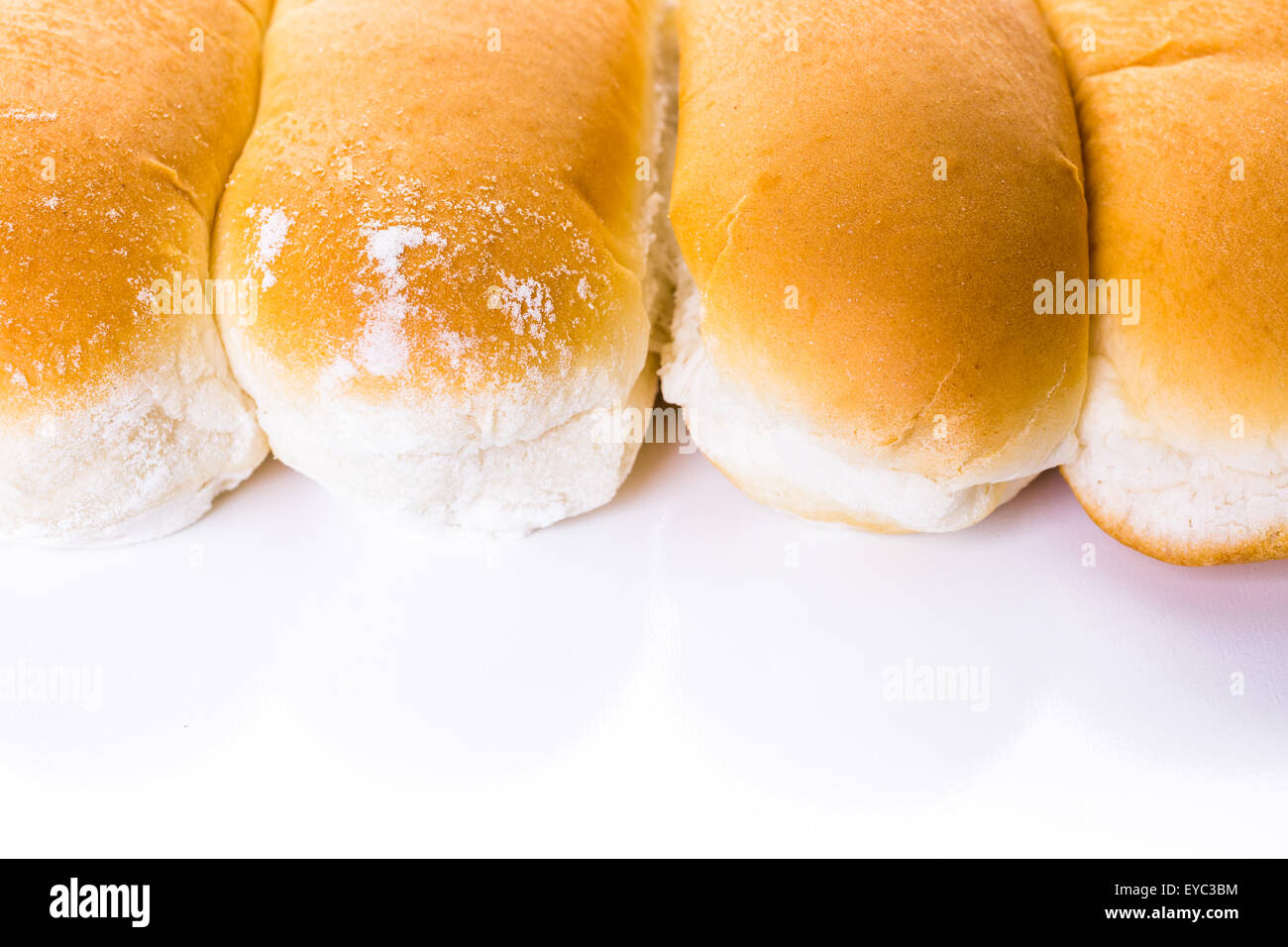Freshly baked hot dog buns on a white background Stock Photo Alamy