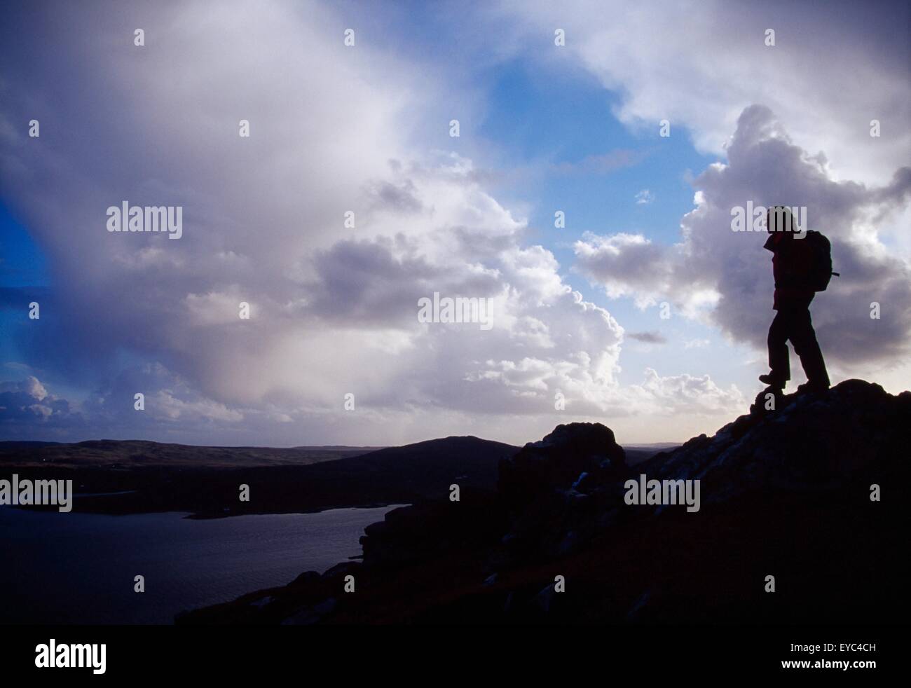 Tully Mountain, Connemara, County Galway, Ireland; Hiker On Mountain Summit Stock Photo