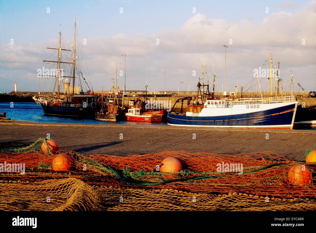 Howth, County Dublin, Ireland; Pier With Fishing Boats And Nets Stock