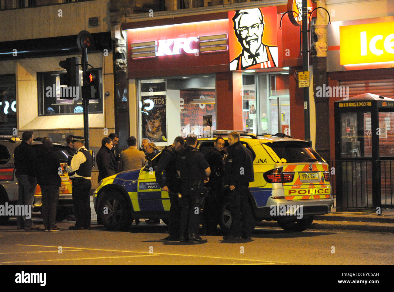 Police officers respond to reports of a suspected armed robbery at the ...
