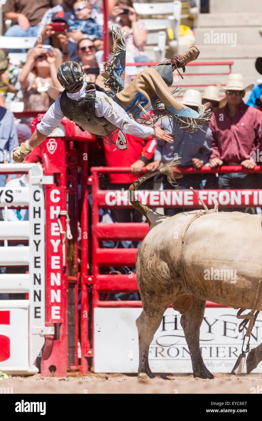 Cheyenne, Wyoming, USA. 26th July, 2015. Bull rider Jeff Bertus is tossed from his bull during the Bull Riding finals at the Cheyenne Frontier Days rodeo in Frontier Park Arena July 26, 2015 in Cheyenne, Wyoming. Frontier Days celebrates the cowboy traditions of the west with a rodeo, parade and fair. Stock Photo