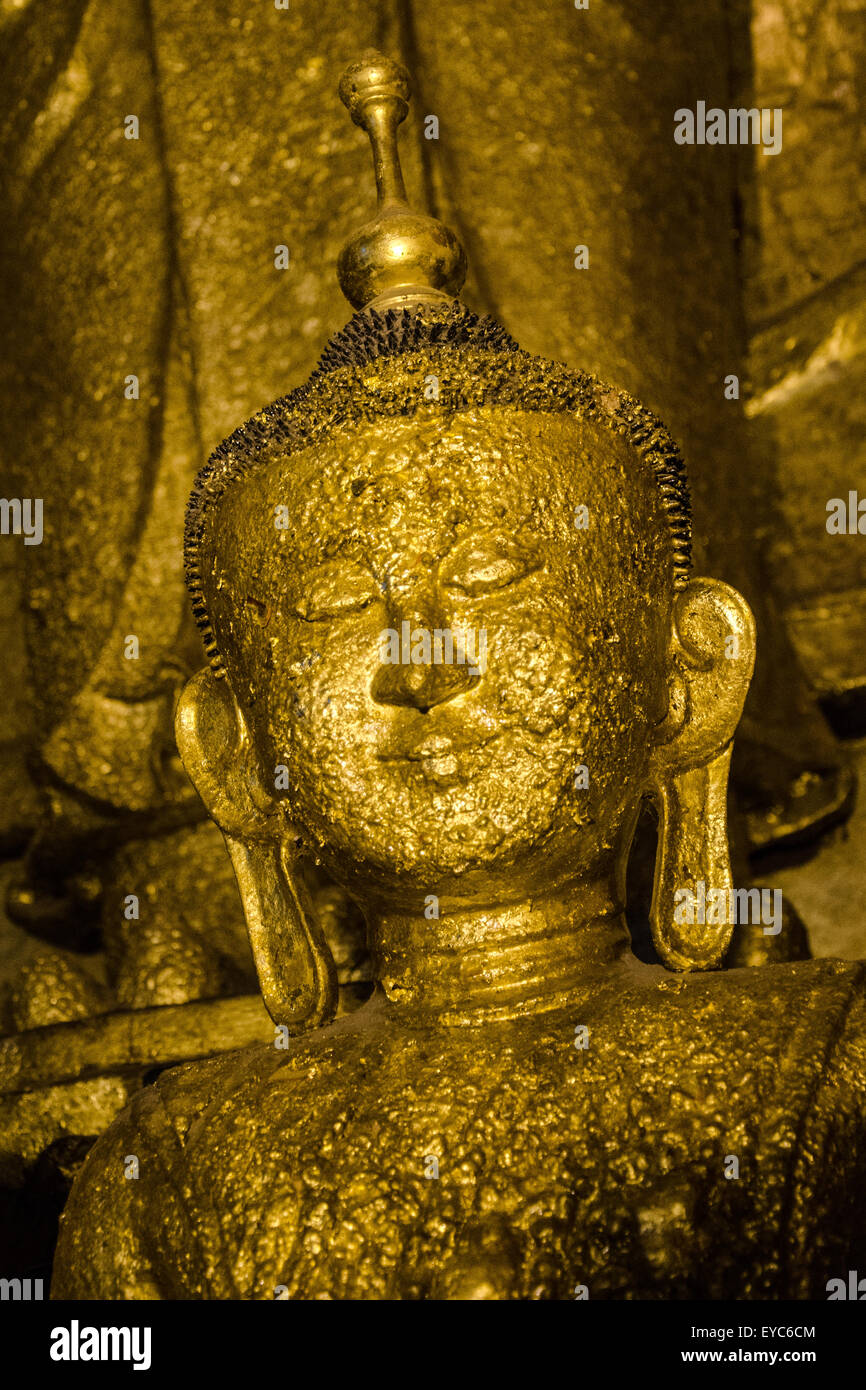 Buddha Statue Disfigured with Gold Leaf Offerings, Ananda Temple, Bagan, Myanmar Stock Photo