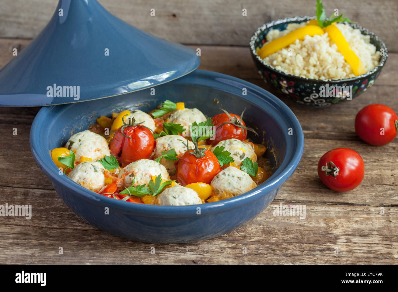Moroccan tagine with chicken kefta (meatballs), red and yellow tomatoes