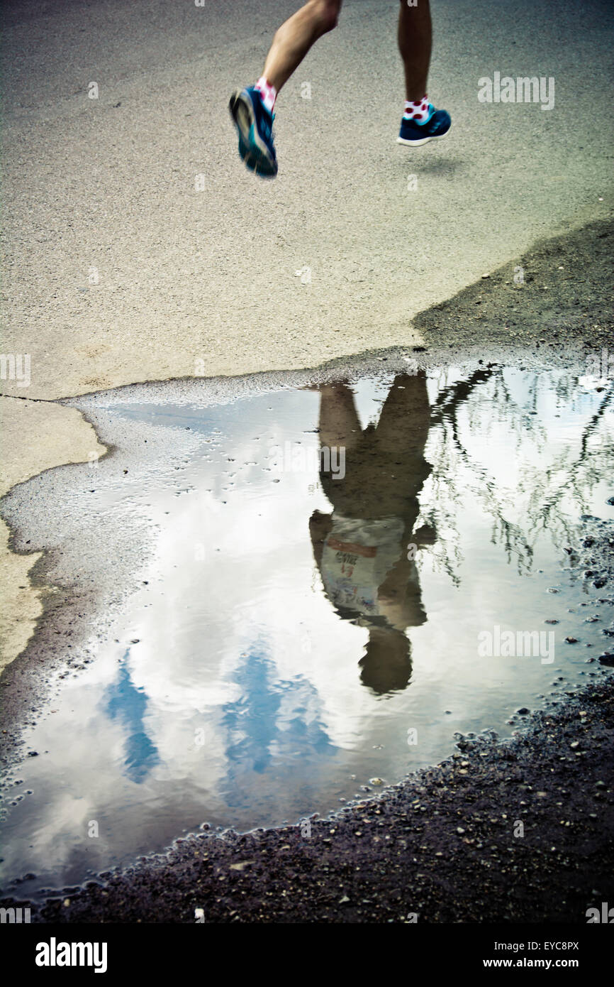 marathon runners legs and reflection Stock Photo