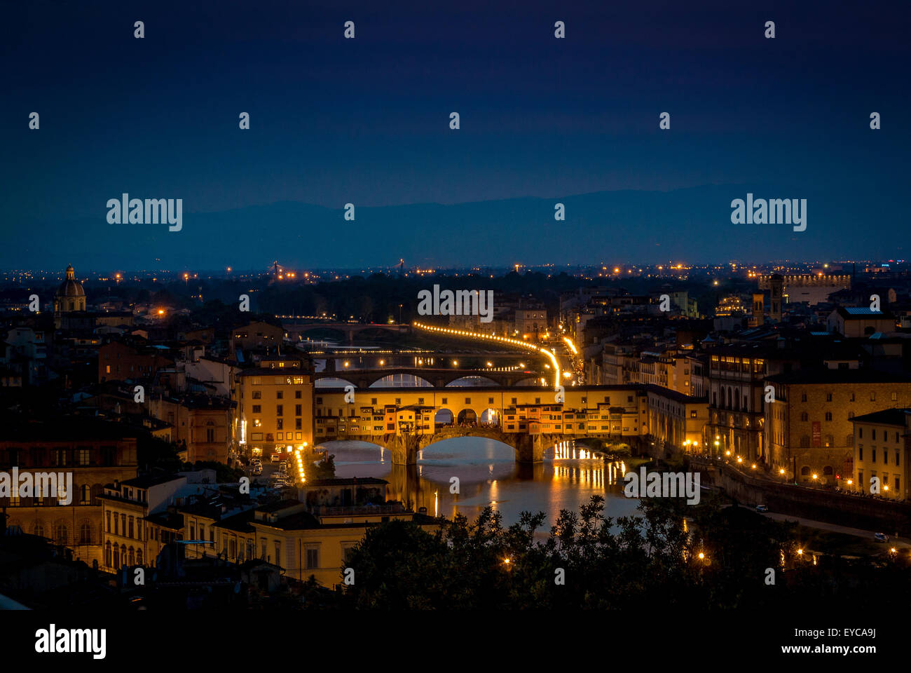 Ponte Vecchio at night shot from the south bank of the river Arno. Florence, Italy. Stock Photo