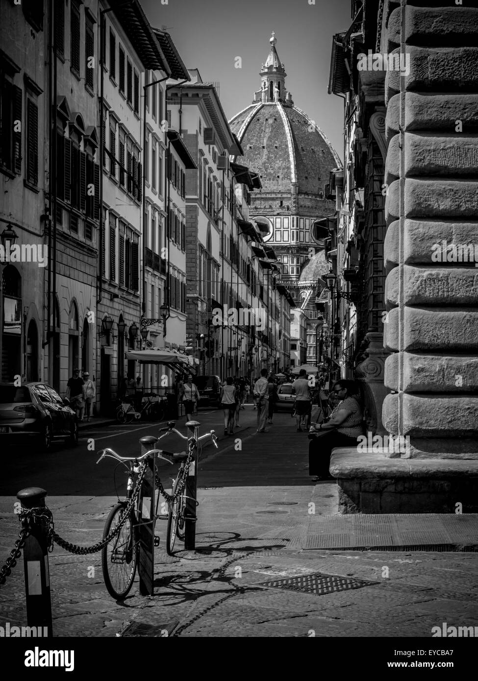 Filippo Brunelleschi's dome on Florence Cathedral glimpsed between buildings in the city of Florence, Italy. Stock Photo