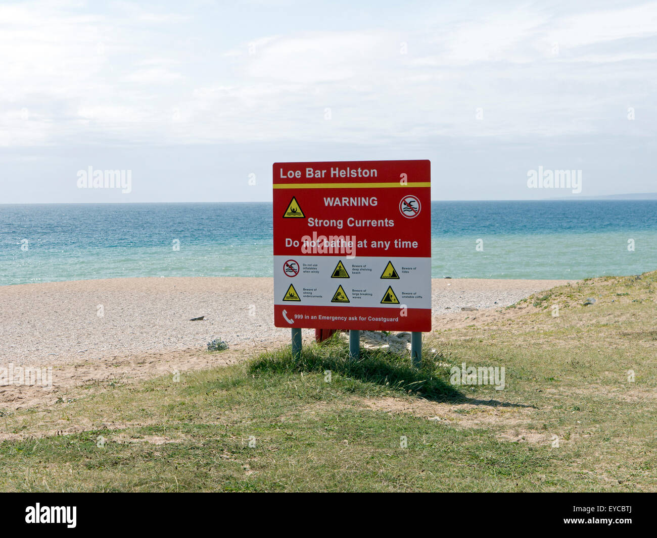 Sign at Loe Bar warning of strong currents and other dangers in the area Stock Photo