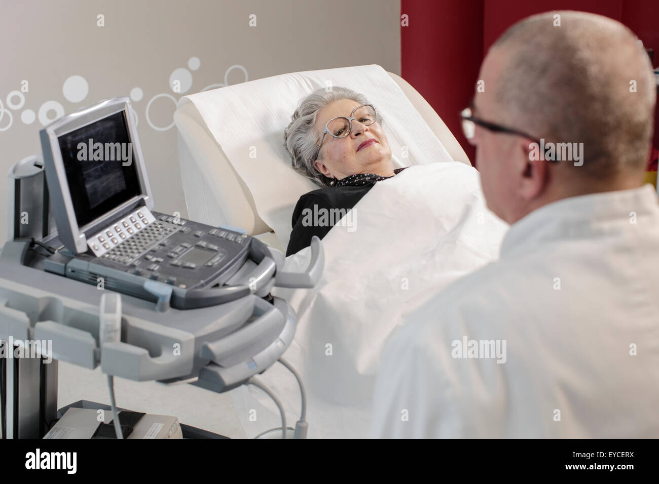 Senior woman in doctor's office Stock Photo