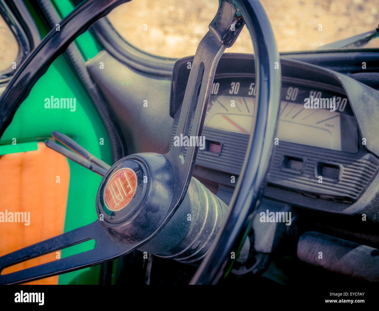 Close-up of a steering wheel on a classic Fiat 500 car. Stock Photo