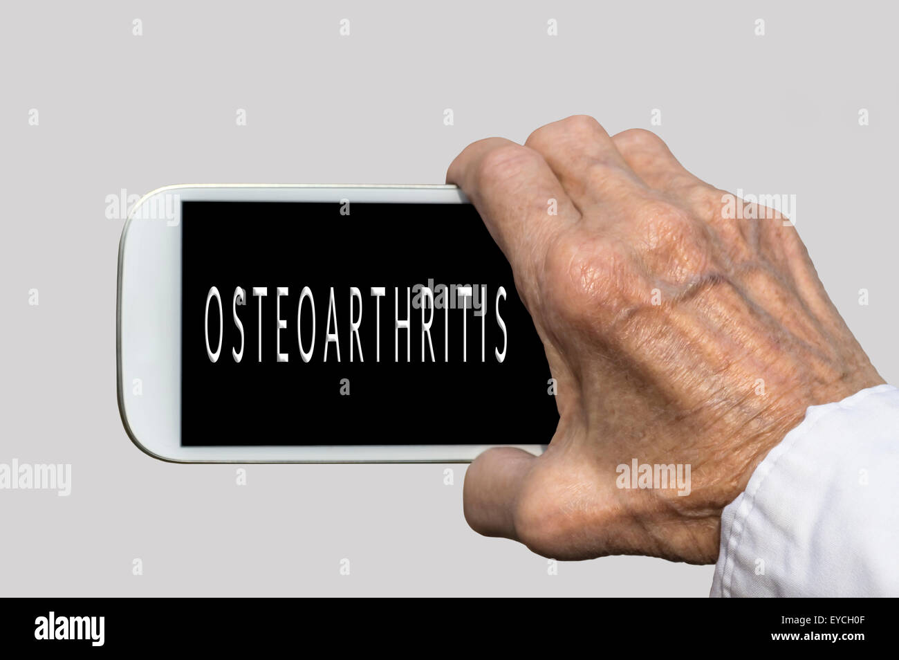Smart phone in old hand with OSTEOARTHRITIS text on screen. Selective focus Stock Photo