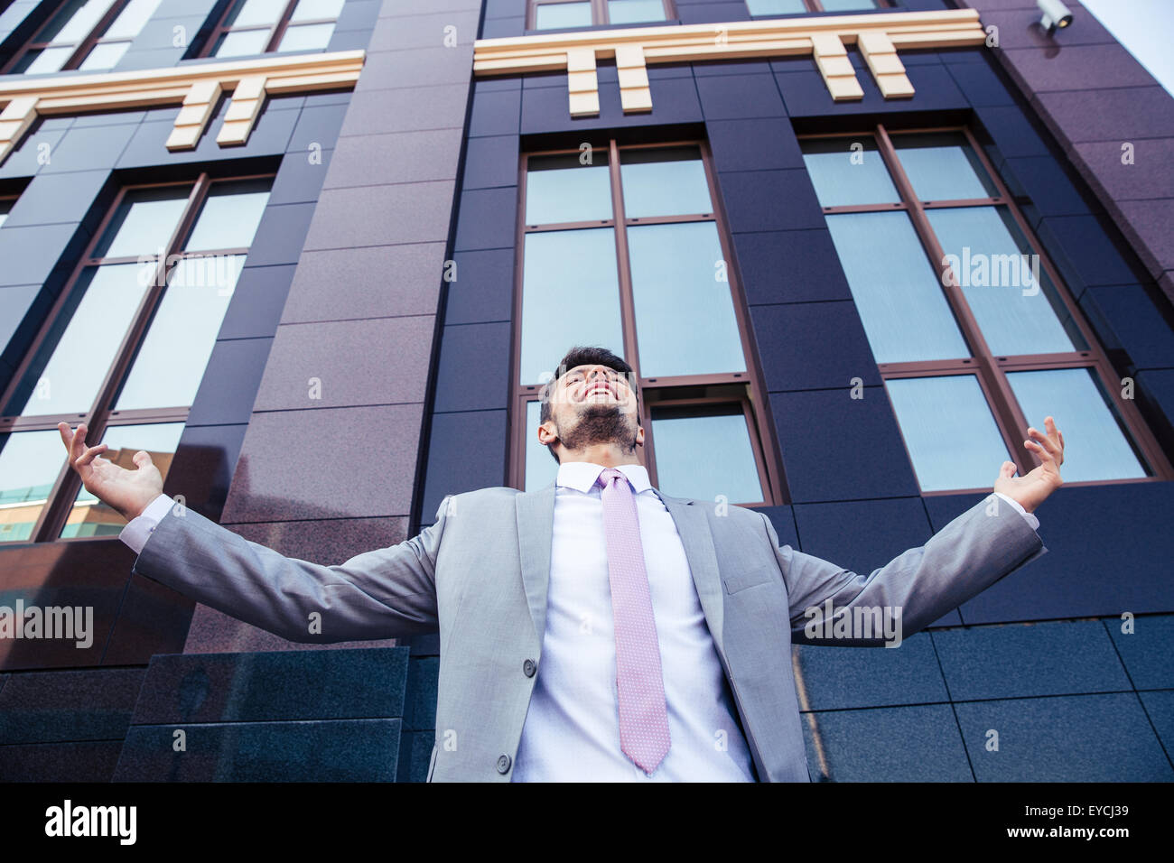 Excited businessman celebrating his success outdoors Stock Photo - Alamy
