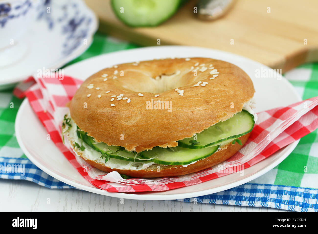 Bagel with cream cheese and cucumber Stock Photo Alamy