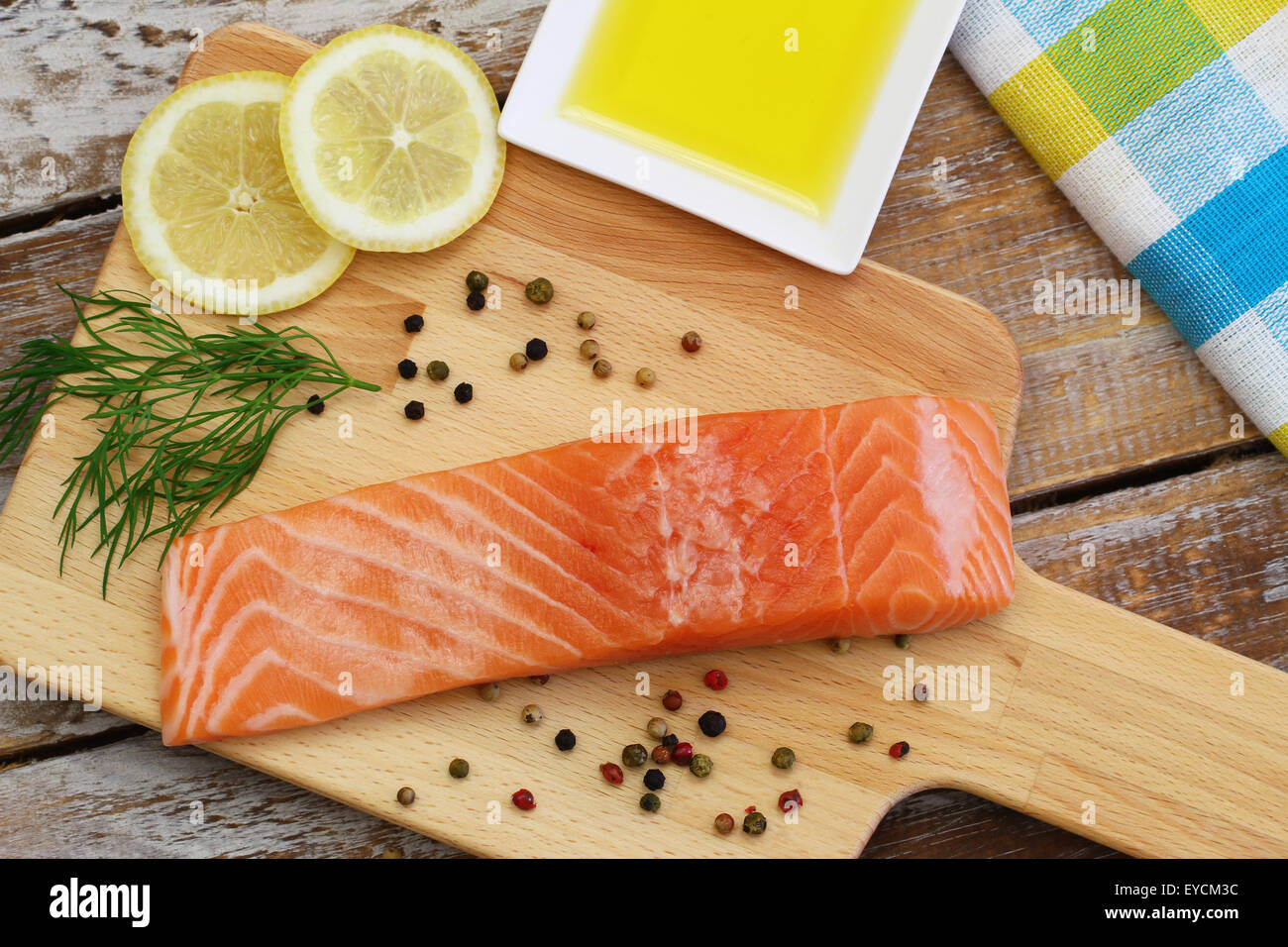Raw salmon steak on wooden board Stock Photo