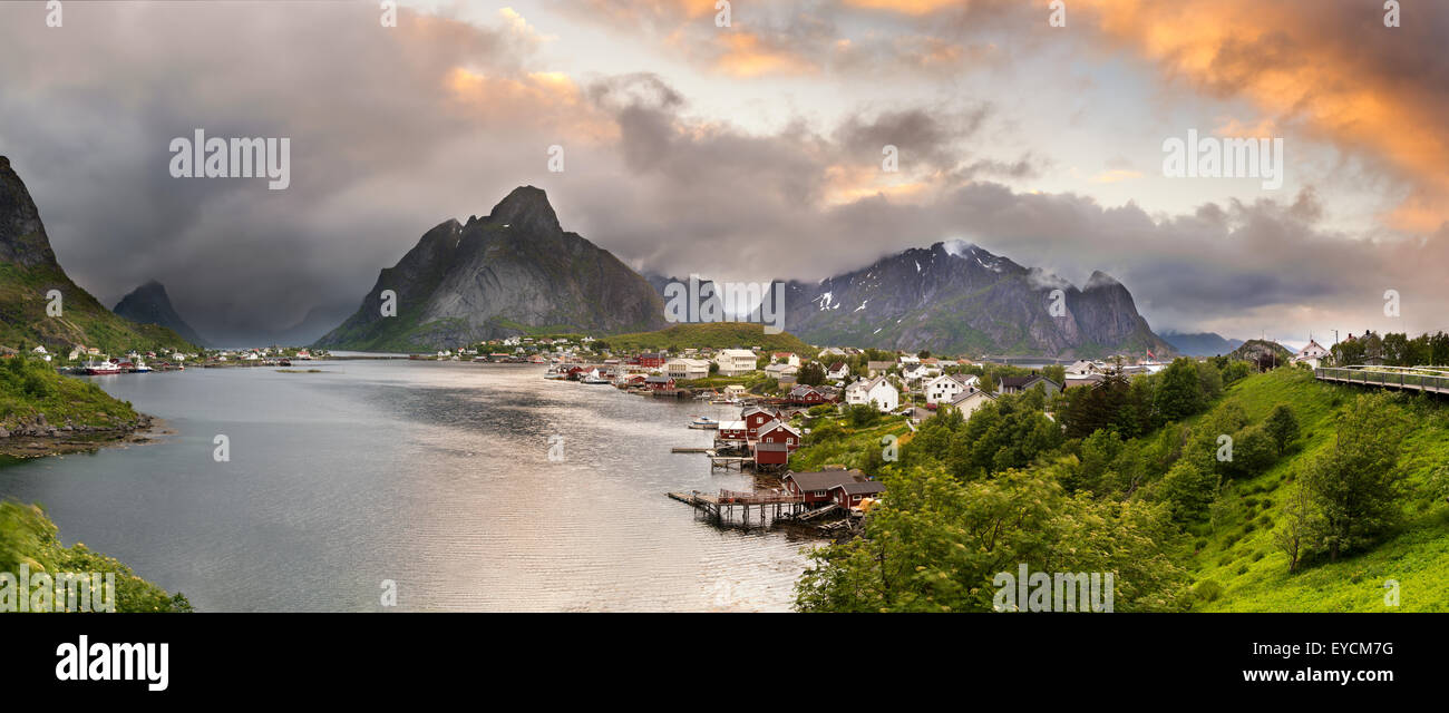 Sunset panorama of  mountains and  Reine fishing village on Lofoten islands in Norway. Stock Photo