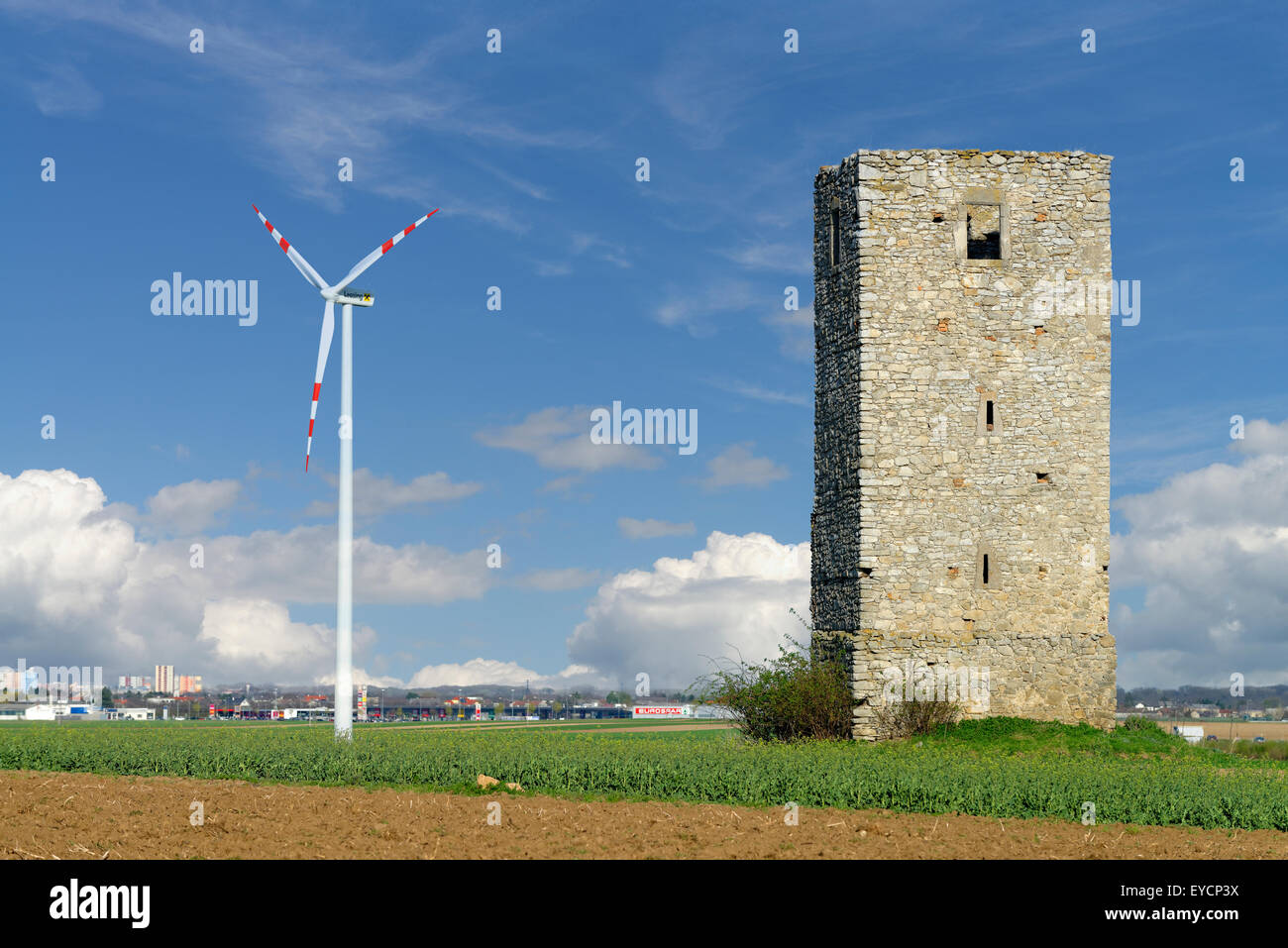 Austria, Burgenland, Kittsee, Heiden tower and wind wheel Stock Photo