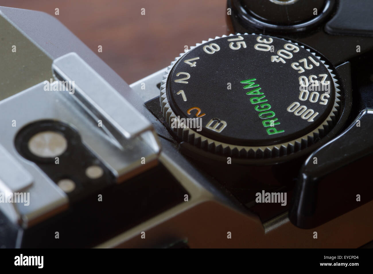 The top of an old Canon AE1 Film camera showing the shutter speed