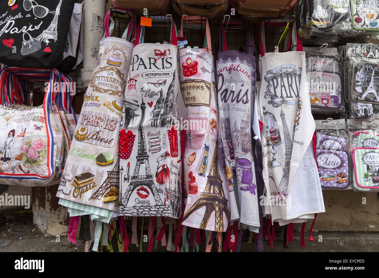 Paris souvenir aprons, bags and other products displayed outside gift shop in Montmartre, Paris Stock Photo