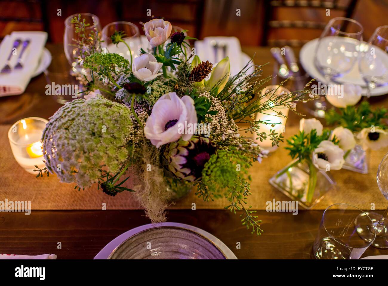 Flower arrangement on dinner party table Stock Photo Alamy