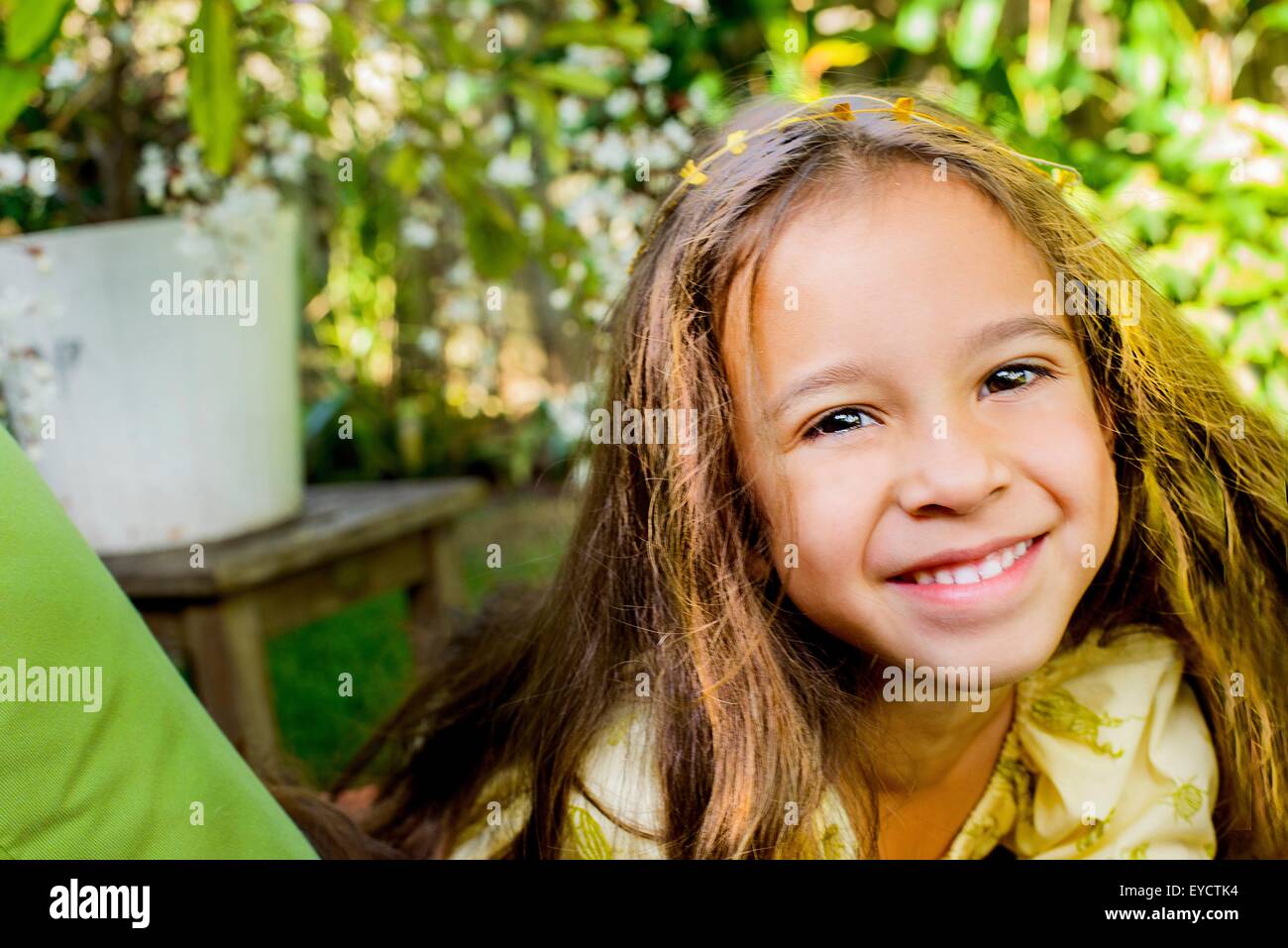 Portrait of pretty smiling girl in garden Stock Photo