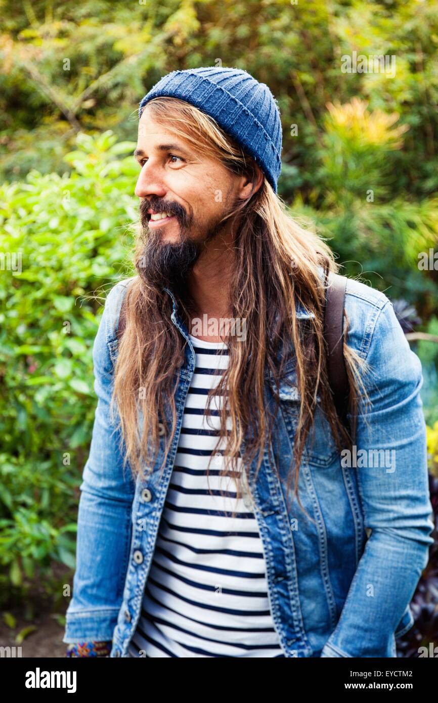 Mid adult man with long hair, wearing hat Stock Photo - Alamy Mid adult man with long hair, wearing hat Stock Photo - Alamy