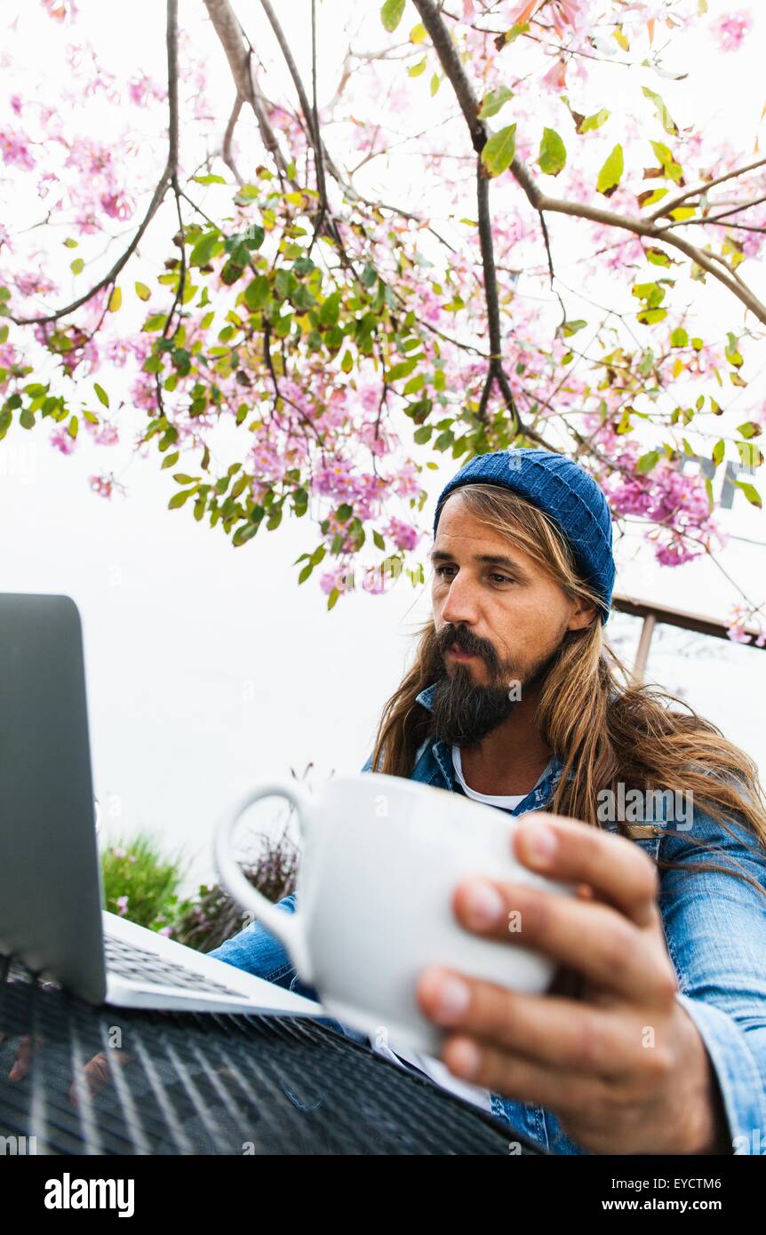 Adult man using laptop hi-res stock photography and images - Alamy