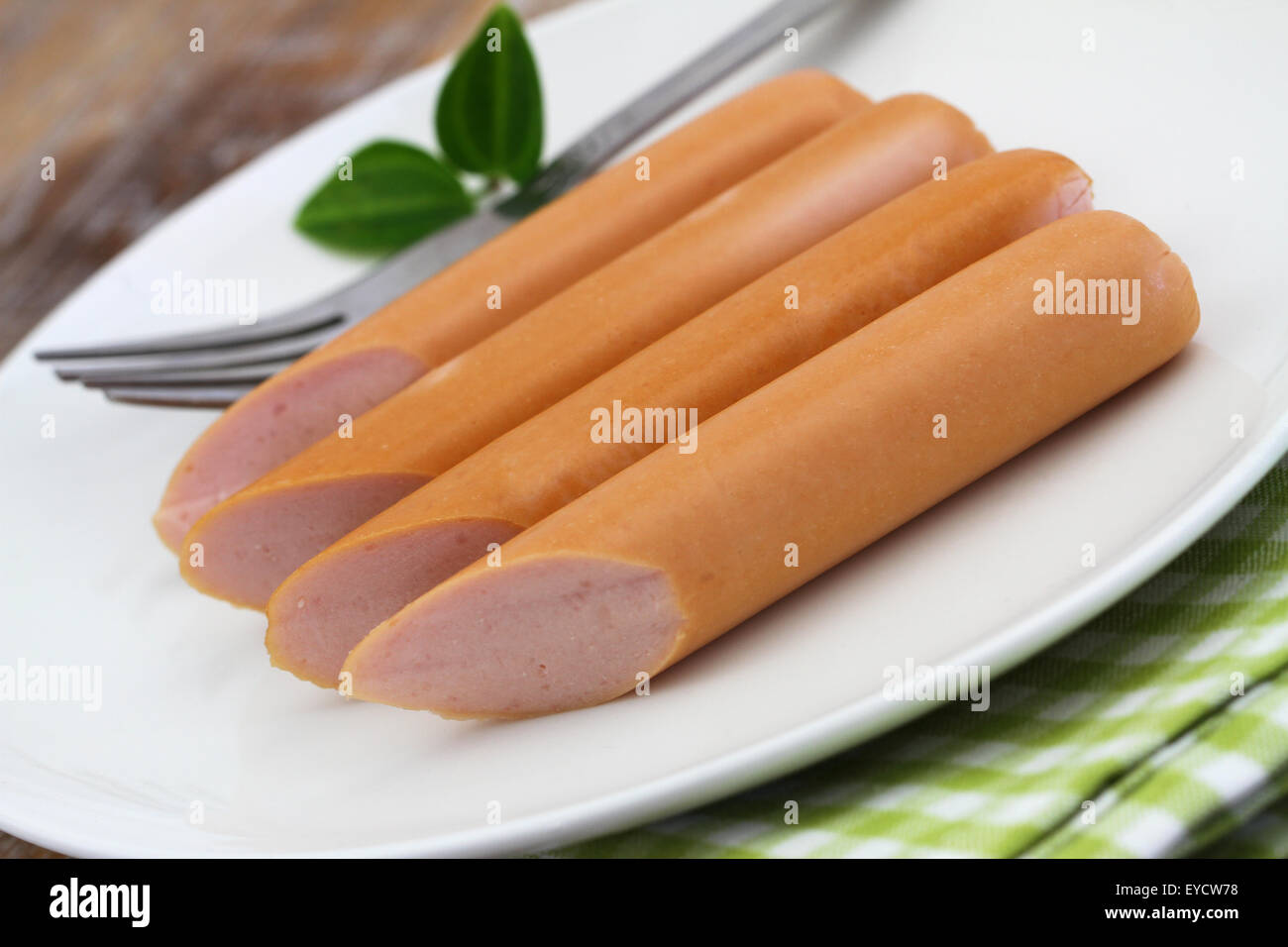 Frankfurters on white plate, closeup Stock Photo