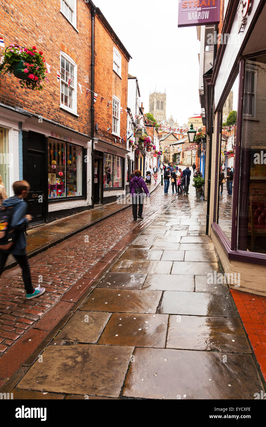 Lincoln city UK Steep Hill looking up to Cathedral at top shops cobbled street England Lincolnshire capital Stock Photo