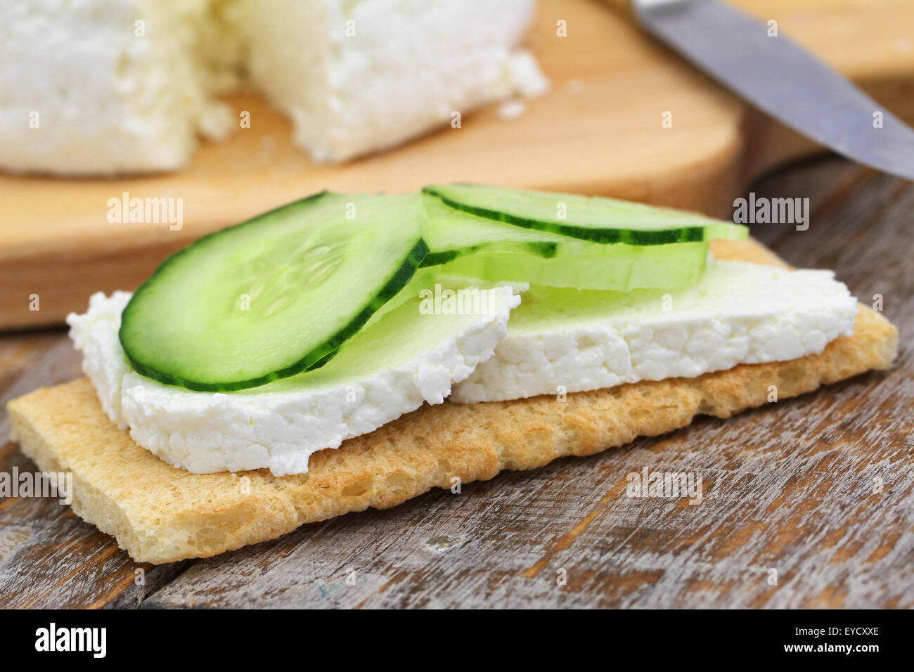 Crisp bread with curd cheese and cucumber Stock Photo