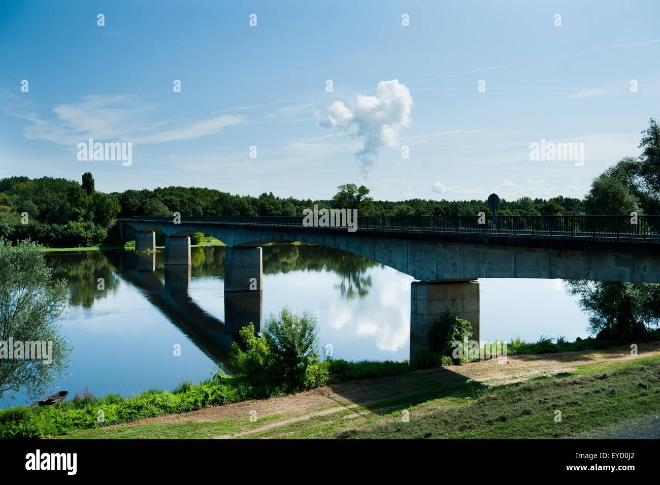 Chinon nuclear power station cooling tower water vapour with bridge and